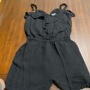 Black stretchy waist romper from the brand BeBe in the size small